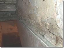 Crumbling plaster caused by Rising Damp