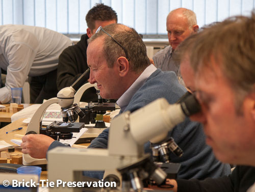 PCA members using microscopes to inspect timber CSRT