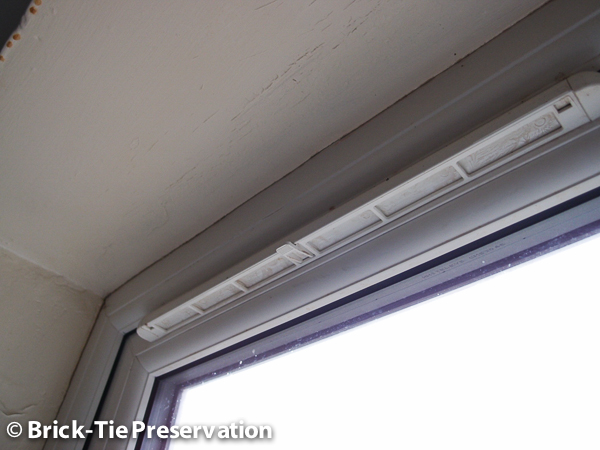 Image of a closed window trickle vent in amould effected house in Selby Yorkshire