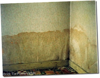 Rising damp in a house which has not been decorated for some years.
