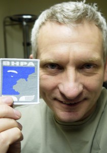 Bryan Hindle and his paragliding pilot rating badge