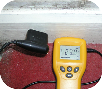 A moisture meter, testing skirting.