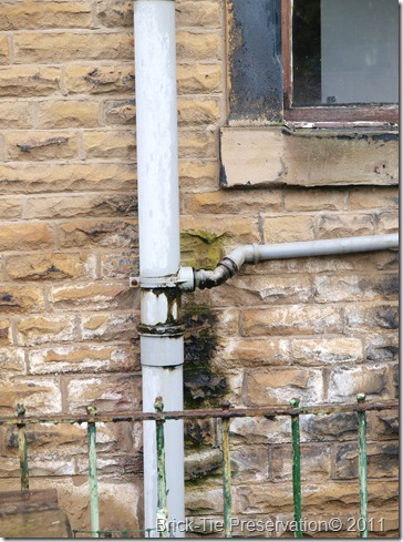 Leaking waste pipe discharging effluent onto a house wall - very bad and unhealthy penetrating damp - Morley, Leeds West Yorkshire.