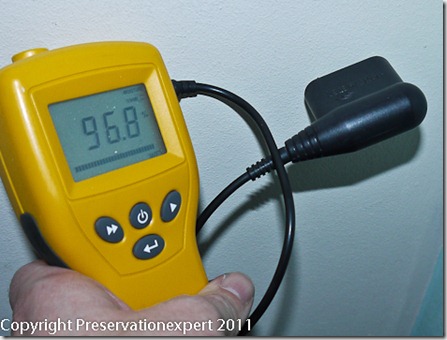 Conductivity moisture meter over-reading due to foil