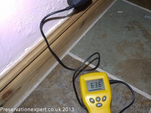 An electrical moisture meter in use